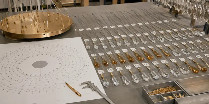 Numbered glass pieces and cable lengths prepared for a custom made chandelier Numbered glass pieces and cable lengths prepared for a custom made chandelier