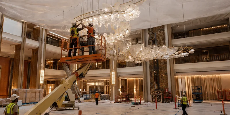 On-site assembly of custom hotel lighting at the ceiling On-site assembly of custom hotel lighting at the ceiling