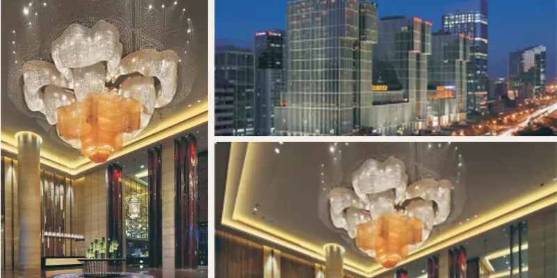 Large hotel lobby chandelier shown in the finished hotel exterior and lobby Large hotel lobby chandelier shown in the finished hotel exterior and lobby