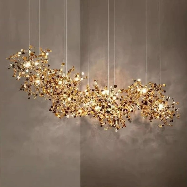 Warm illuminated cluster chandelier with amber-toned accents and staggered suspension cables Warm illuminated cluster chandelier with amber-toned accents and staggered suspension cables