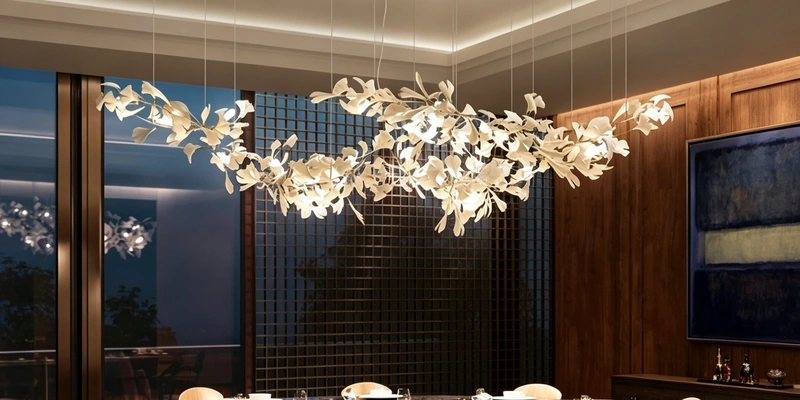White leaf chandelier suspended above a round dining table in a warm interior White leaf chandelier suspended above a round dining table in a warm interior