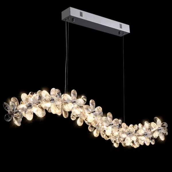 Wave-shaped decorative chandelier with a rectangular canopy and suspended clear elements Wave-shaped decorative chandelier with a rectangular canopy and suspended clear elements
