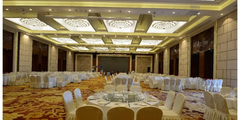 Hotel ballroom chandelier lighting arranged for banquet and event layouts