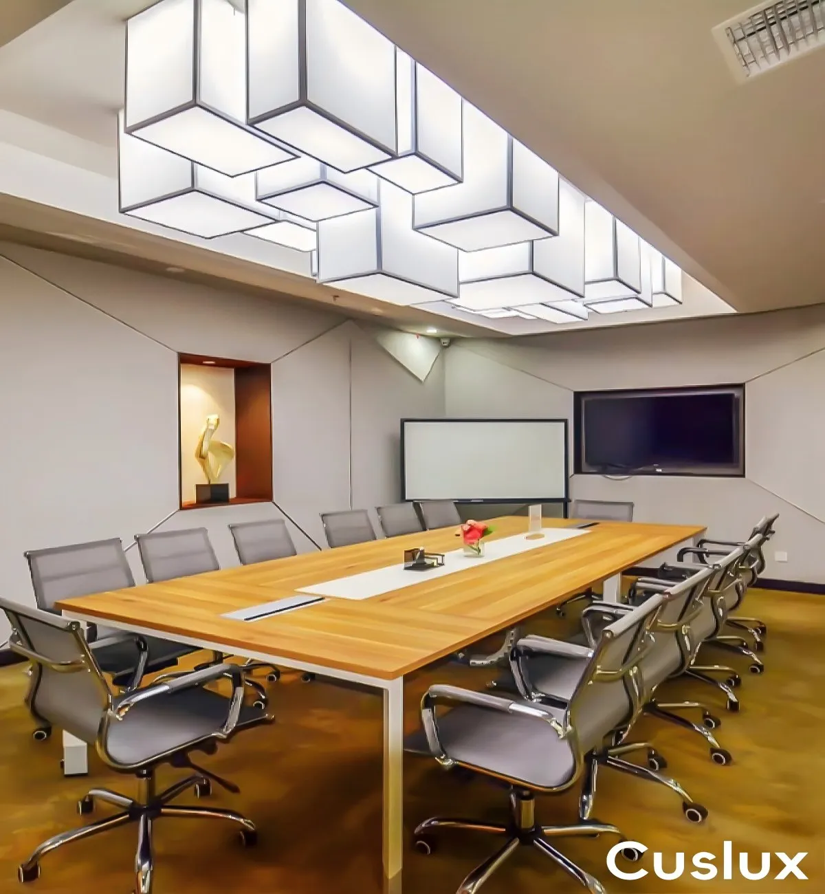 Geometric cube chandelier above a hotel dining area.webp